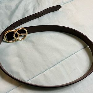 Black leather belt with gold clasp.